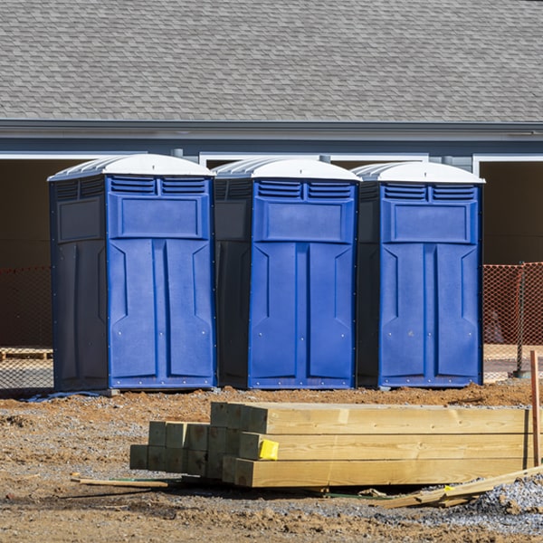 what is the cost difference between standard and deluxe portable restroom rentals in Warden